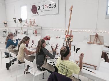 Students attend a class at the new Art By Era art studio